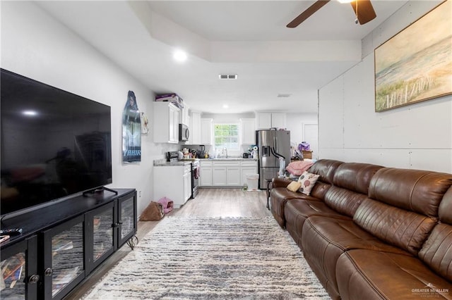 1600 Pullin Ave, San Juan, TX 78589 - living room with light wood finished floors and ceiling fan