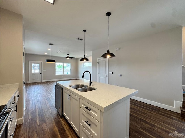 1600 Monterrey Cir, Brownsville, TX 78526 - kitchen featuring stainless steel dishwasher, dark wood-style floors, range, open floor plan, and light countertops