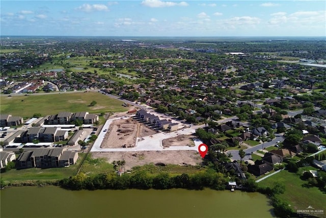 bird's eye view with a water view and a residential view