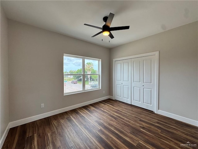 1600 Monterrey Cir, Brownsville, TX 78526 - unfurnished bedroom with dark wood-type flooring, a closet, and ceiling fan