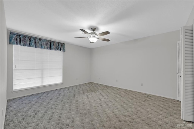 5618 Jack Nicklaus Dr, Palm Valley, TX 78552 - carpeted empty room with baseboards and a ceiling fan