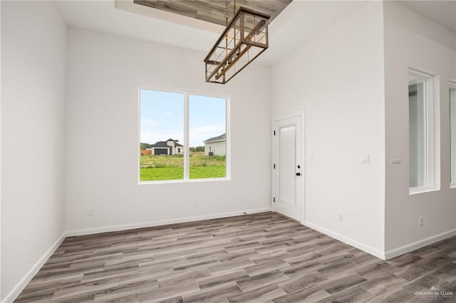 interior space featuring a chandelier and light hardwood / wood-style flooring