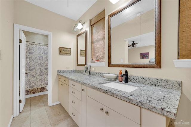 1205 Susan Dr, Edinburg, TX 78539 - full bathroom featuring tile patterned floors, baseboards, vanity, and a shower with shower curtain