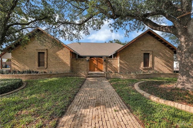 1205 Susan Dr, Edinburg, TX 78539 - view of front of home featuring brick siding and a front lawn