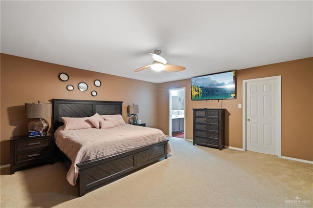 3155 Obsidian Dr, Brownsville, TX 78526 - bedroom featuring light colored carpet, baseboards, ceiling fan, and ensuite bathroom