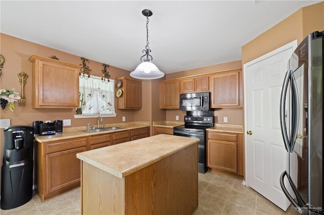 3155 Obsidian Dr, Brownsville, TX 78526 - kitchen featuring appliances with stainless steel finishes, a sink, light countertops, a kitchen island, and hanging light fixtures