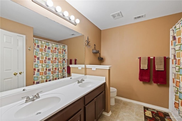 3155 Obsidian Dr, Brownsville, TX 78526 - full bath with toilet, double vanity, baseboards, tile patterned floors, and a shower with shower curtain