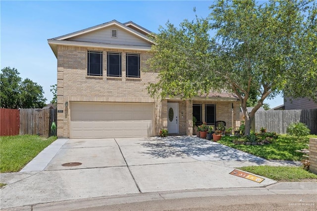 3155 Obsidian Dr, Brownsville, TX 78526 - traditional-style house with brick siding, an attached garage, fence, concrete driveway, and covered porch