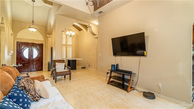 2904 Victoria St, Hidalgo, TX 78557 - tiled living area featuring a chandelier and a towering ceiling