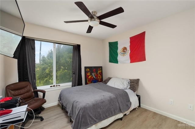 1448 W B St, Mission, TX 78572 - bedroom featuring wood finished floors and ceiling fan