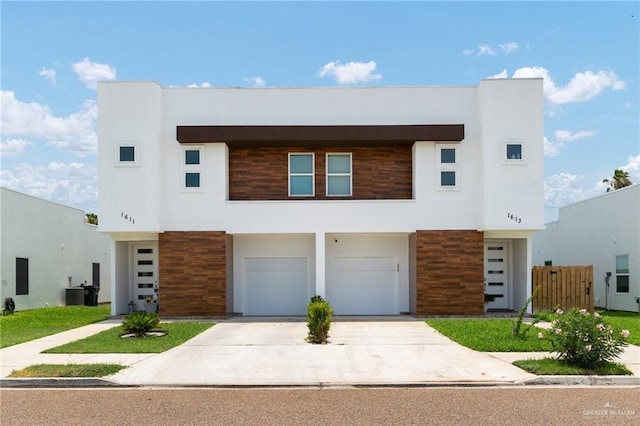 1448 W B St, Mission, TX 78572 - modern home featuring concrete driveway, stucco siding, and an attached garage