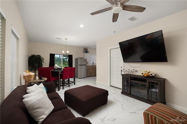 1448 W B St, Mission, TX 78572 - living area featuring light marble finish flooring, a chandelier, recessed lighting, and ceiling fan