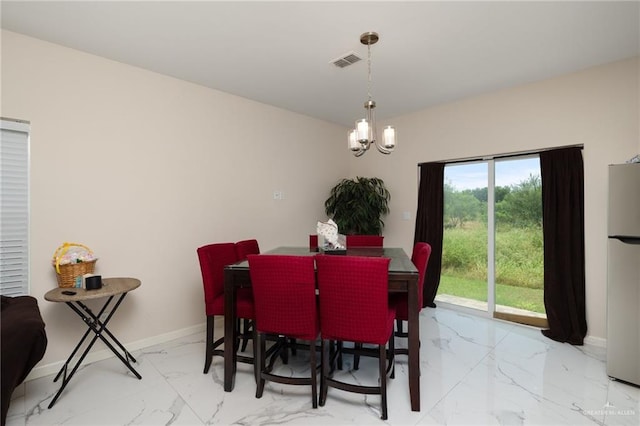 1448 W B St, Mission, TX 78572 - dining room featuring light marble finish floors and a chandelier