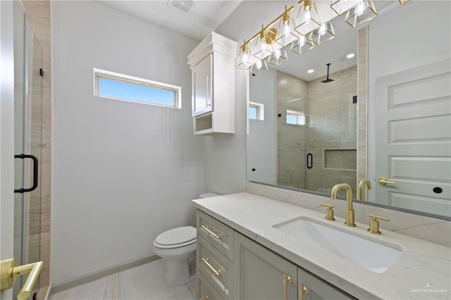 bathroom featuring visible vents, a stall shower, toilet, and vanity