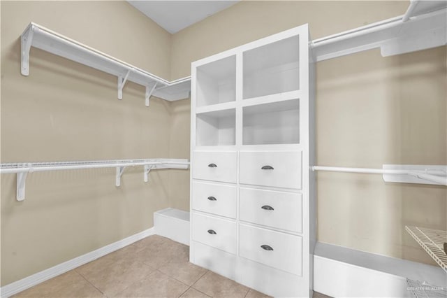 walk in closet featuring light tile patterned floors