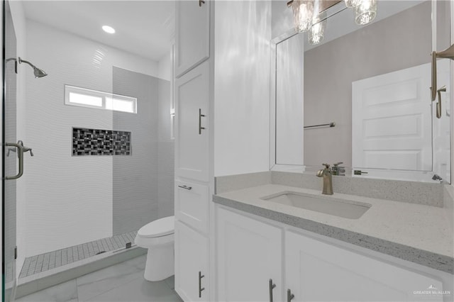 full bath featuring marble finish floor, a shower stall, toilet, and vanity