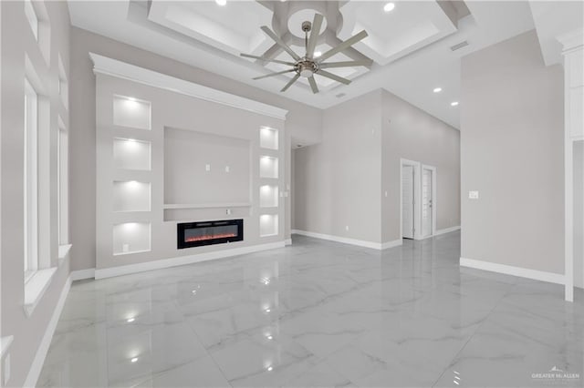 unfurnished living room with marble finish floor, a glass covered fireplace, ceiling fan, coffered ceiling, and baseboards