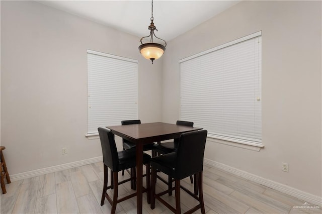 dining room with light hardwood / wood-style flooring