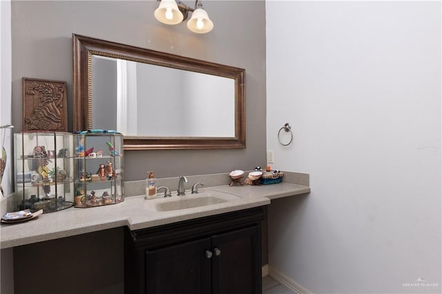 bathroom featuring vanity and a chandelier