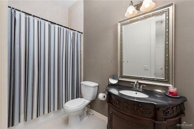 bathroom with tile patterned flooring, vanity, curtained shower, and toilet