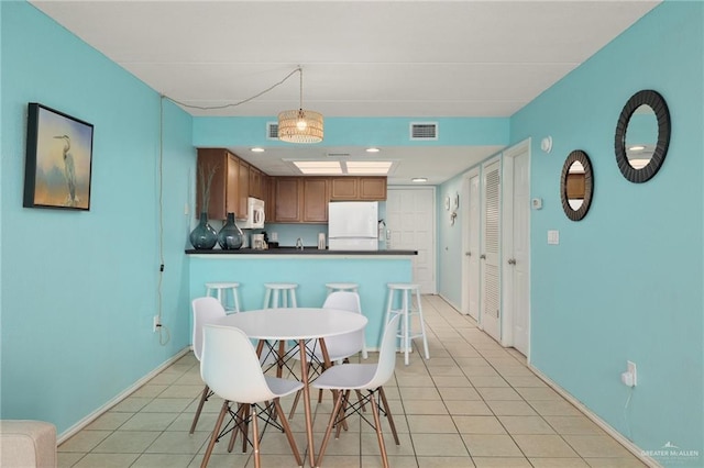 108 E Coronado Dr Unit 207, South Padre Island, TX 78597 - dining space with light tile patterned flooring and recessed lighting