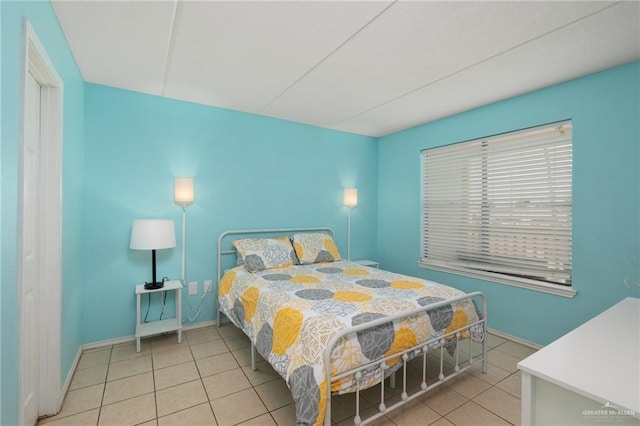 108 E Coronado Dr Unit 207, South Padre Island, TX 78597 - bedroom with light tile patterned flooring and baseboards