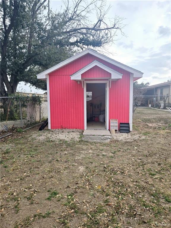 view of shed with fence