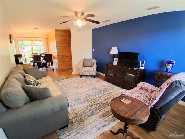 613 W Sprague St, Edinburg, TX 78539 - living room with a chandelier, wood finished floors, and a ceiling fan