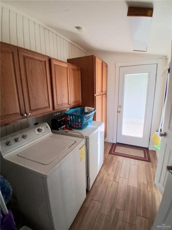 613 W Sprague St, Edinburg, TX 78539 - laundry room with cabinet space, separate washer and dryer, and light wood finished floors