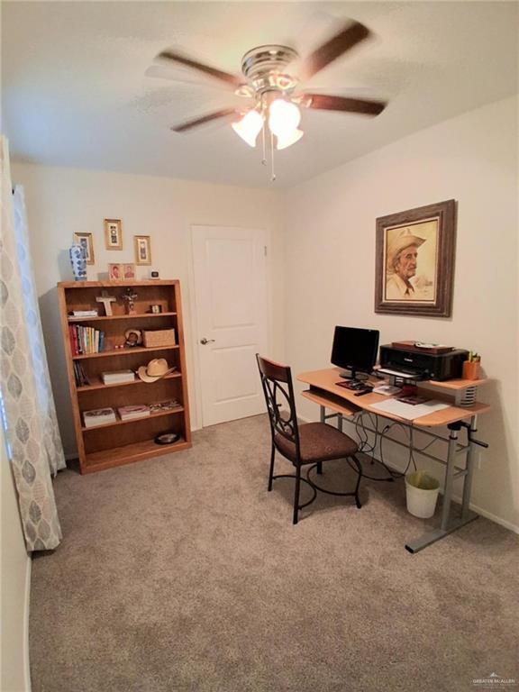 613 W Sprague St, Edinburg, TX 78539 - home office featuring a ceiling fan, carpet floors, and baseboards