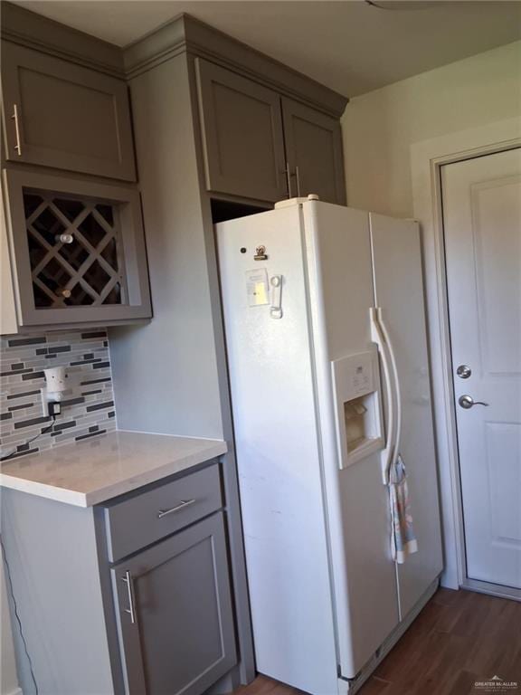 613 W Sprague St, Edinburg, TX 78539 - kitchen with white refrigerator with ice dispenser, gray cabinetry, tasteful backsplash, wood finished floors, and light countertops