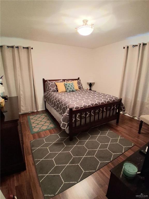 613 W Sprague St, Edinburg, TX 78539 - bedroom with wood finished floors