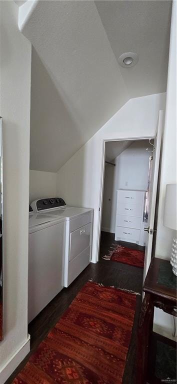 laundry area featuring laundry area, dark wood-style flooring, and washing machine and clothes dryer