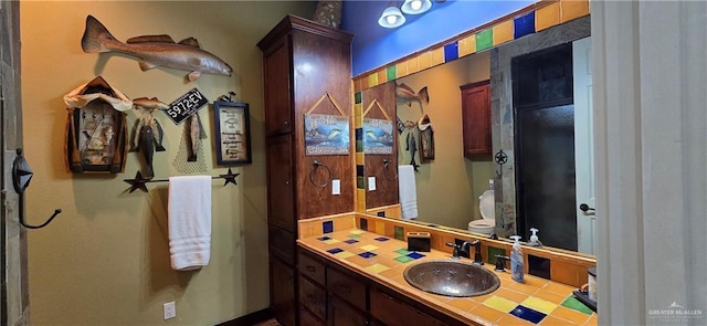 bathroom with toilet and vanity