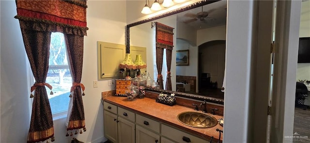 bathroom with vanity and a ceiling fan