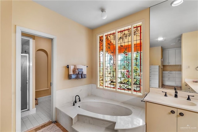 27101 N State Highway 345, San Benito, TX 78586 - bathroom with vanity, a bath, a stall shower, and tile patterned floors