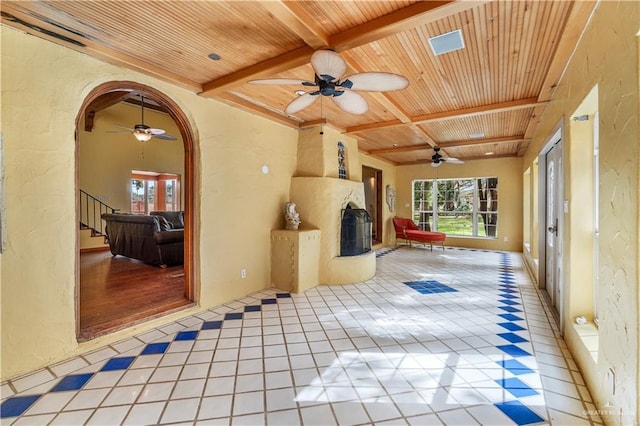 27101 N State Highway 345, San Benito, TX 78586 - unfurnished sunroom featuring plenty of natural light, beamed ceiling, and arched walkways