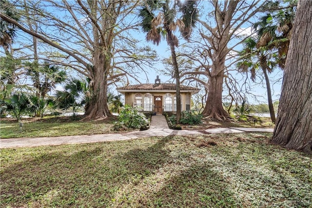 27101 N State Highway 345, San Benito, TX 78586 - view of front of property featuring a chimney and a front yard
