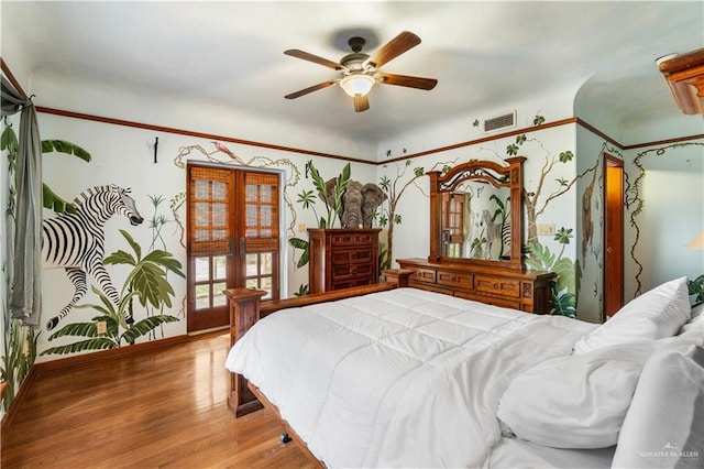 27101 N State Highway 345, San Benito, TX 78586 - bedroom featuring wood finished floors, a ceiling fan, and french doors