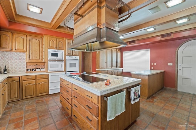 27101 N State Highway 345, San Benito, TX 78586 - kitchen featuring white appliances, a center island with sink, light countertops, arched walkways, and island exhaust hood
