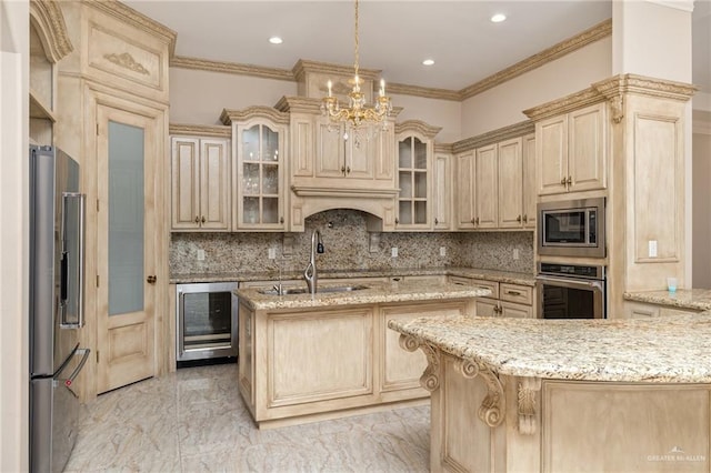 kitchen with appliances with stainless steel finishes, light brown cabinets, tasteful backsplash, wine cooler, and sink