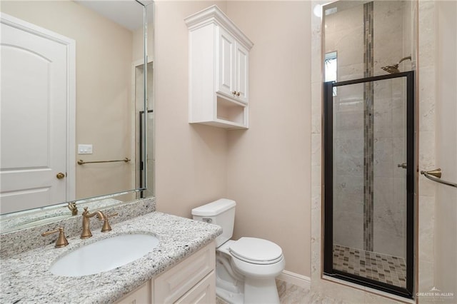 bathroom with a shower with shower door, toilet, and vanity