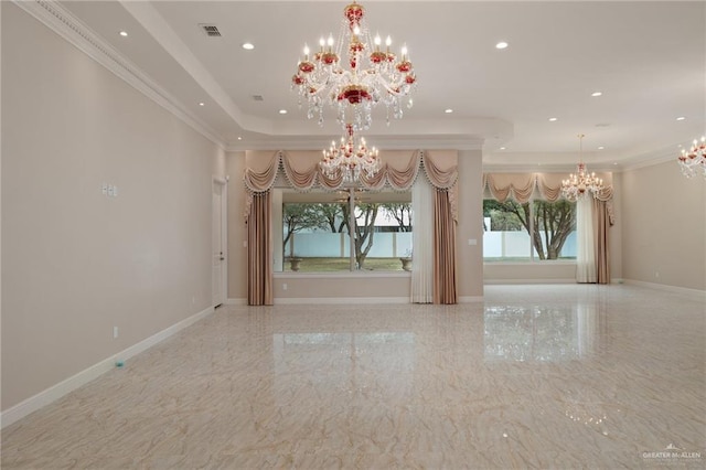 unfurnished room featuring crown molding, a tray ceiling, and an inviting chandelier