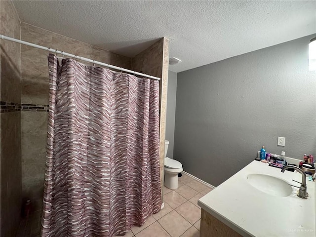 bathroom with vanity, a textured ceiling, tile patterned flooring, toilet, and curtained shower