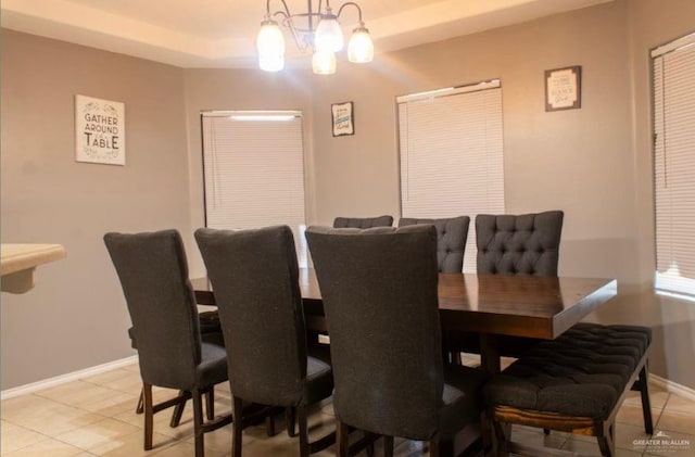 dining area featuring a notable chandelier and light tile patterned floors