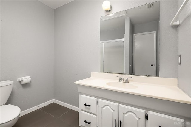 bathroom with tile patterned floors, vanity, and toilet