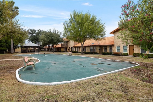 view of pool featuring a gazebo and a yard