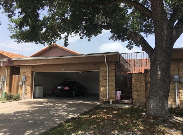 view of side of home featuring a garage