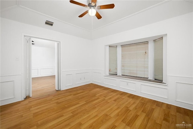 empty room featuring ceiling fan and light hardwood / wood-style floors