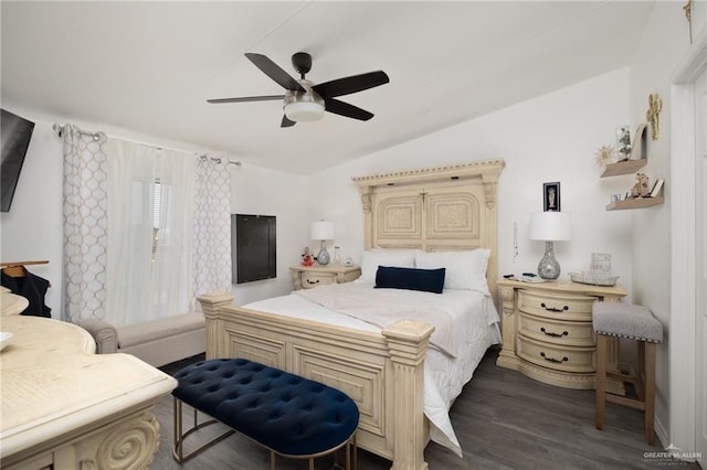 bedroom featuring dark hardwood / wood-style flooring, ceiling fan, and lofted ceiling